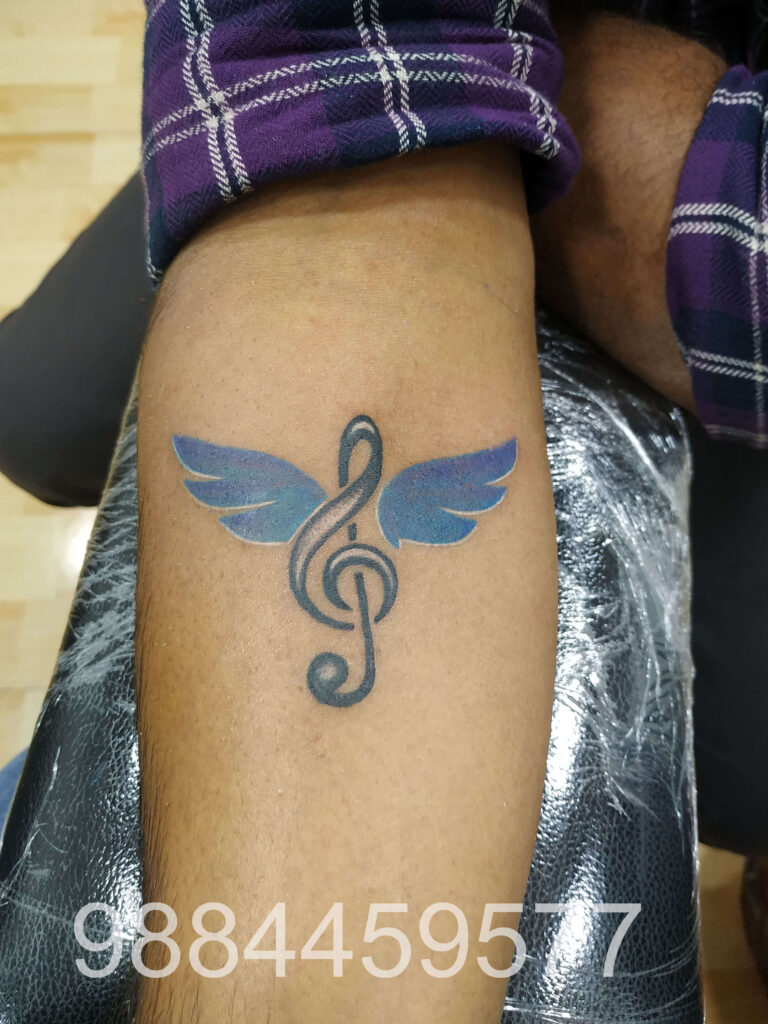 music with wings tattoo