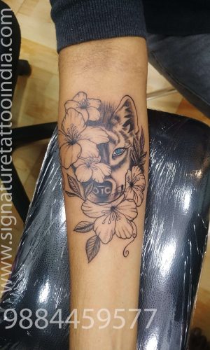 wolf with flower tattoo